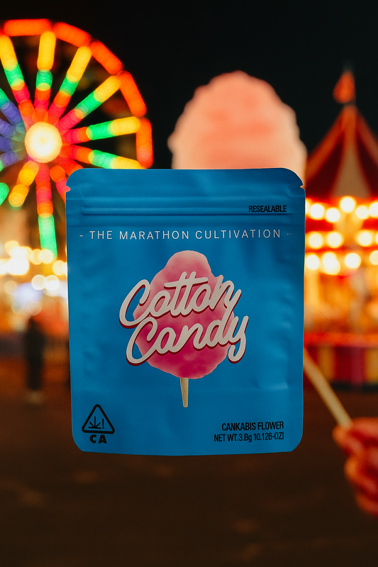 Cannabis flower packaging labeled 'Cotton Candy' with a colorful ferris wheel in the background