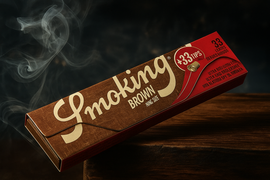 Brown rolling paper pack with 'Smoking' branding on a dark background